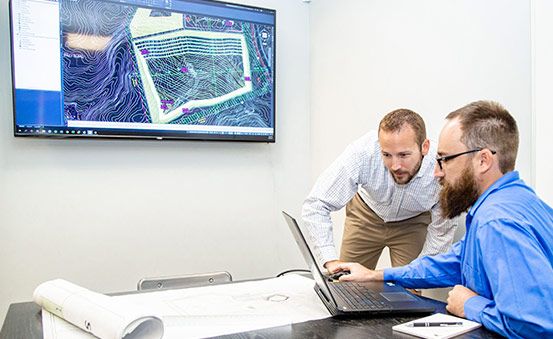 geotechnical-engineers-looking-over-soil-sampling-evaluation